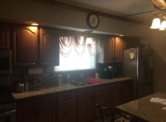 Kitchen cabinetry refinishing project by JK We Love to Paint
